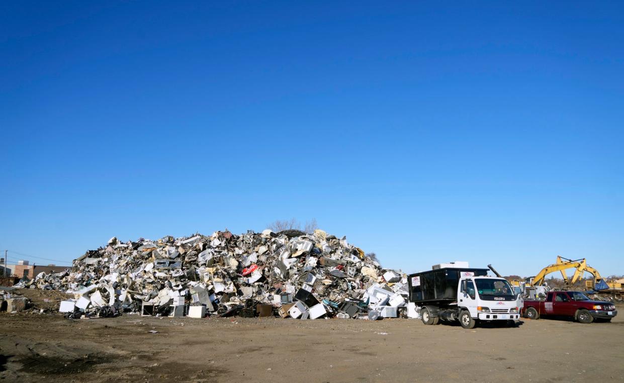 Scrap metal piles up at Rhode Island Recycled Metals, located on a former brownfields site stretching from Allens Avenue to the Providence River that once was home to an electronics-recycling operation.
