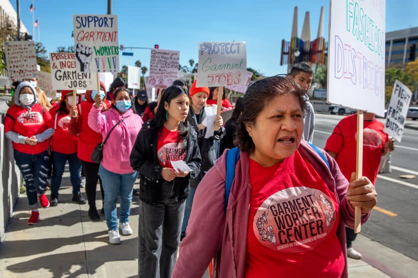 LOS ANGELES, CA - APRIL 04: The Protect LA's Garment Jobs Coalition, along with garment workers and labor and affordable-housing allies, pushing for changes to the DTLA 2040 Community Plan rally outside City Hall on Tuesday, April 4, 2023 in Los Angeles, CA. (Irfan Khan / Los Angeles Times)