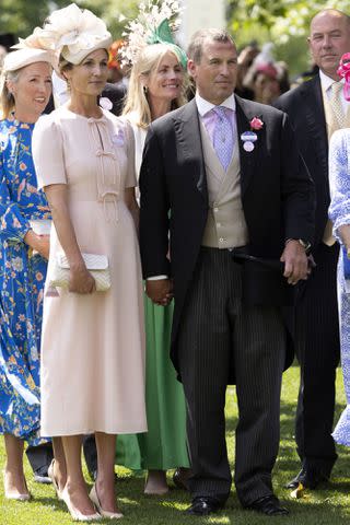 <p>David Hartley/Shutterstock</p> Harriet Sperling and Peter Phillips hold hands at Royal Ascot on June 21, 2024