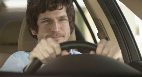 Young man driving car