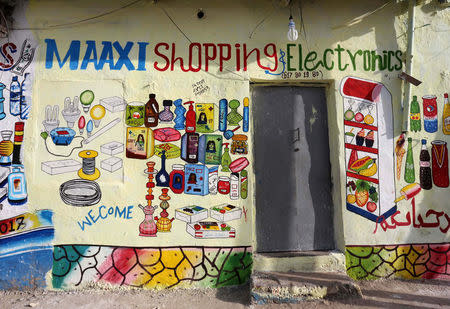 A mural on the wall of a shop illustrates electrical appliances, cosmetics and beverages in Hamarweyne district of Mogadishu, Somalia, June 8, 2017. REUTERS/Feisal Omar