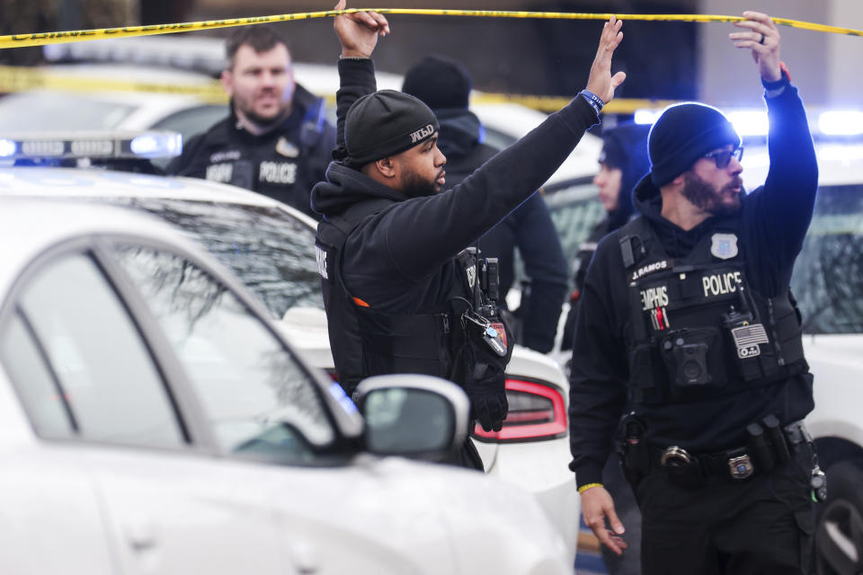 Law enforcement personnel work at the scene of a shooting at a Tennessee library, Thursday, Feb. 2, 2023, in Memphis. Authorities say one person is dead and a police officer was critically wounded. (Patrick Lantrip/Daily Memphian via AP)