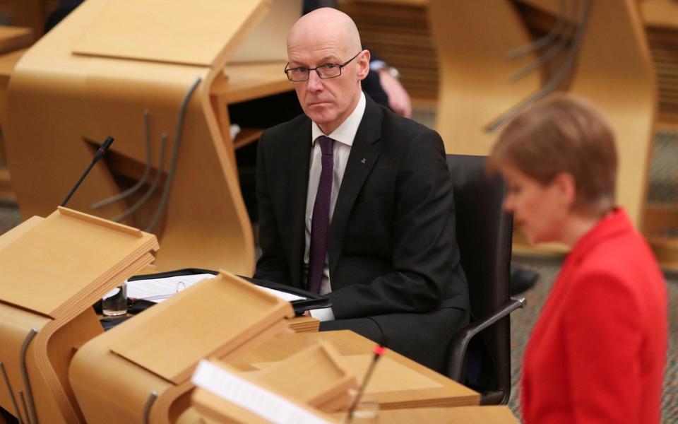 John Swinney, the education secretary, said a phased return was likely - Russell Cheyne/PA