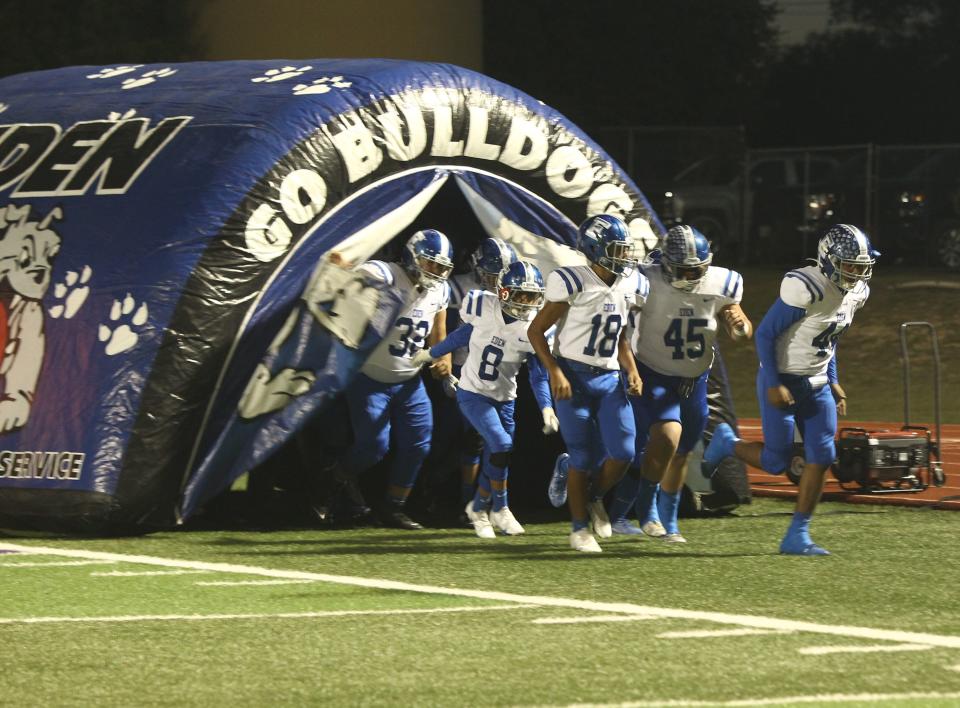 The Eden High School football team runs out of its tunnel and onto the field before a District 14-1A Division I football game against Irion County Friday, Nov. 5, 2021 at O.K. Wolfenbarger Field in Mertzon.