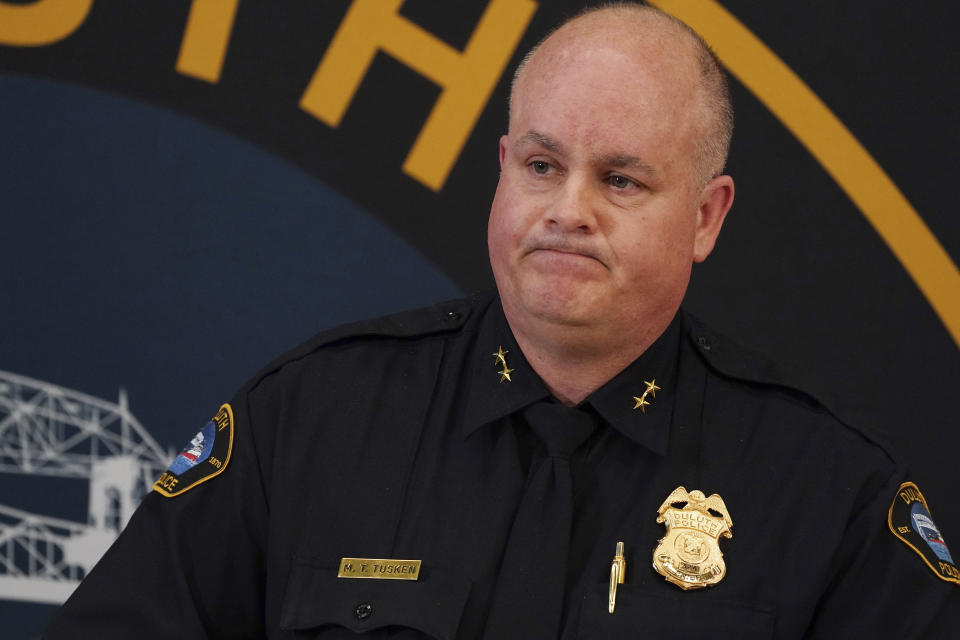 Duluth Police Chief Mike Tusken pauses as he takes questions podium during a press conference to speak about the scene the day prior where five people and a dog were found dead of gunshot wounds inside a home on East 12th Street after police received a report of a male experiencing a mental health crisis Thursday, April 21, 2022, in Duluth, Minn. (Anthony Souffle/Star Tribune via AP)