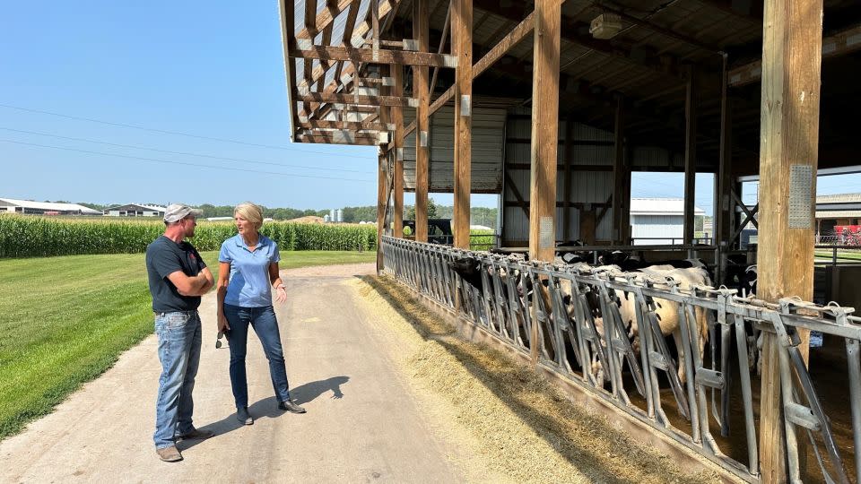 Beth Ford on a farm this past summer in Wisconsin, with member-owner Evan Hillan. - Courtesy Land O’Lakes, Inc.