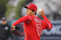 Los Angeles Angels designated hitter Shohei Ohtani throws to the plate during the first inning of a baseball game against the Texas Rangers Tuesday, April 20, 2021, in Anaheim, Calif. (AP Photo/Mark J. Terrill)