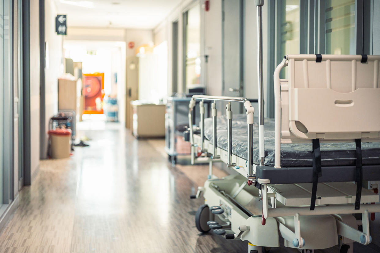 Empty hospital beds in hospital corridor Getty Images/Jackyenjoyphotography