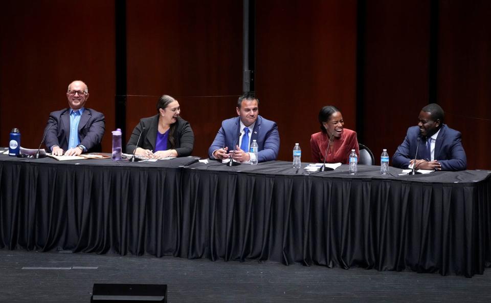 From left, Donald Carlson, Sandra Cano, Walter Berbrick, Stephanie Beauté and Gabe Amo react during a lighter moment in the second half of the 2023 Rhode Island CD1 special election candidate forum.