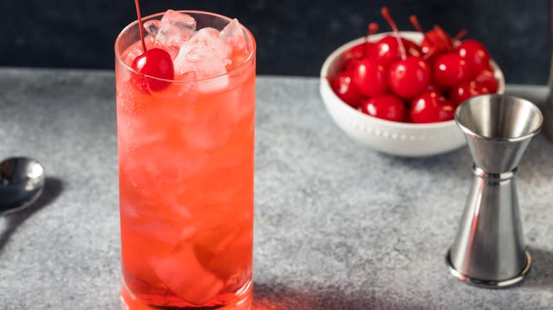 A Shirley Temple and bowl of cherries