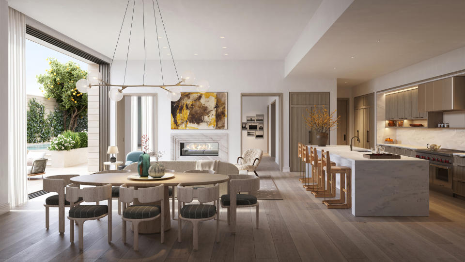 Living, dining and kitchen area inside a condo at Rosewood Residences Beverly Hills.