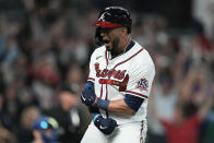 Atlanta Braves' Eddie Rosario celebrates after hitting a three run home run during the fourth inning in Game 6 of baseball's National League Championship Series against the Los Angeles Dodgers Saturday, Oct. 23, 2021, in Atlanta.(AP Photo/Ashley Landis)