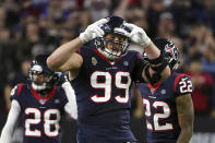 FILE - Houston Texans defensive end J.J. Watt (99) celebrates during the second half of an NFL wild-card playoff football game against the Buffalo Bills in Houston, in this Saturday, Jan. 4, 2020, file photo. J.J. Watt has agreed to a two-year contract with the Arizona Cardinals. The team announced the deal with the free-agent edge rusher on Monday, March 1, 2021. Watt was released last month by the Houston Texans. (AP Photo/Eric Christian Smith, File)