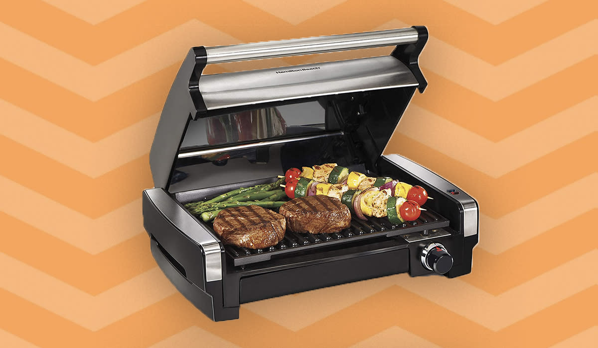 steak and veggies on a portable grill