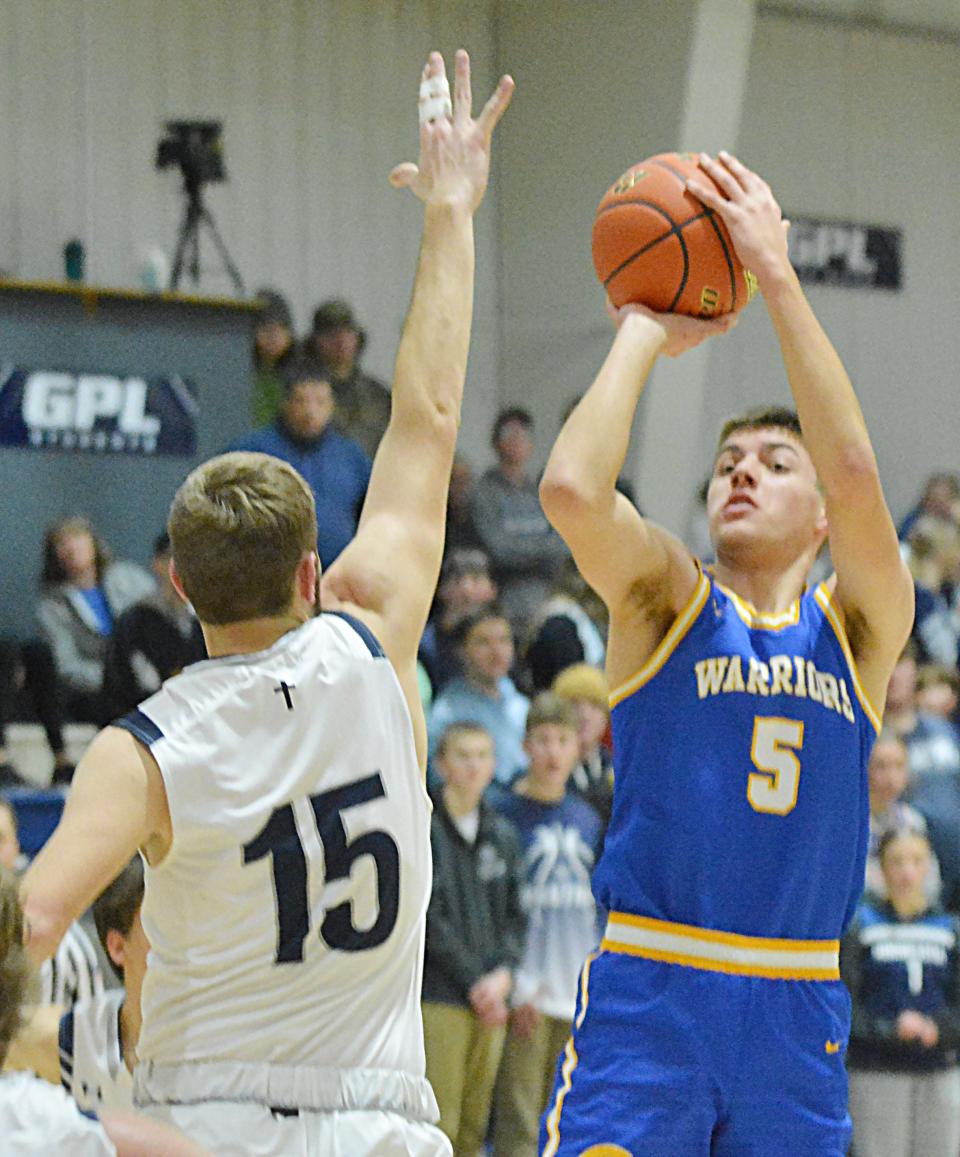 Castlewood's Brody Bass shoots over Great Plains Lutheran's Martin Krenz during their high school boys basketball game on Thursday, Jan. 11, 2024 in Watertown. Top-rated Castlewood won 68-38.