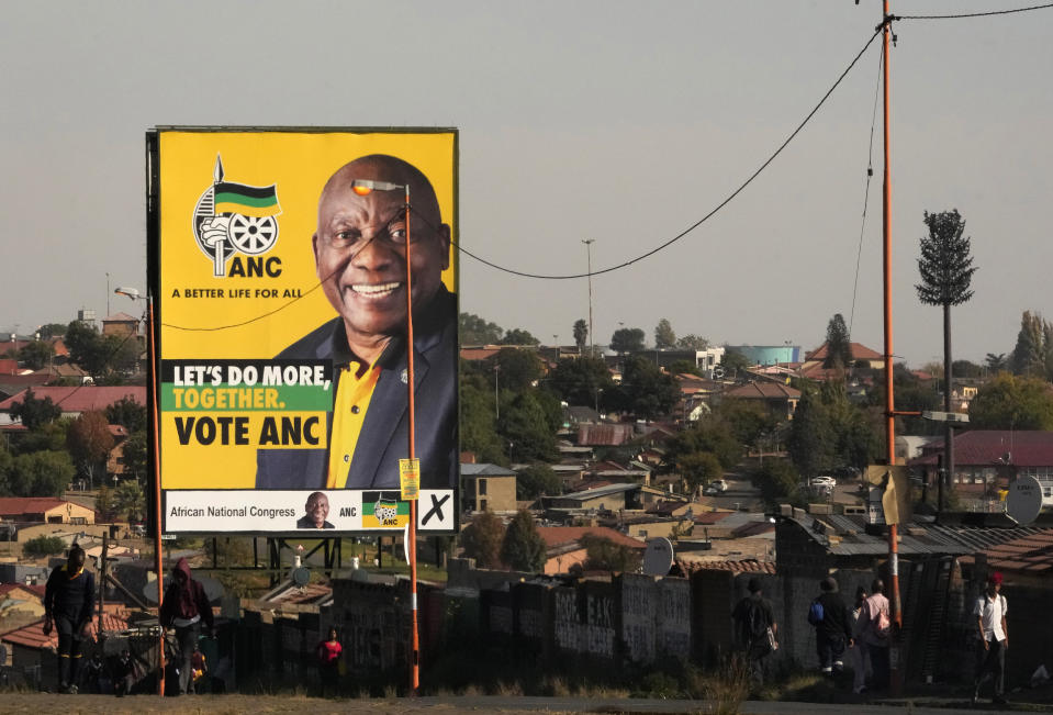 File - An election poster, with President Cyril Ramaphosa atop a pole in Soweto, South Africa, on April 22, 2024. A campaign video for South Africa’s opposition party showing the country’s flag in flames has stoked tensions just weeks ahead of national elections that are seen as the most pivotal since the end of the apartheid system of racial segregation 30 years ago. (AP Photo/Themba Hadebe, File)