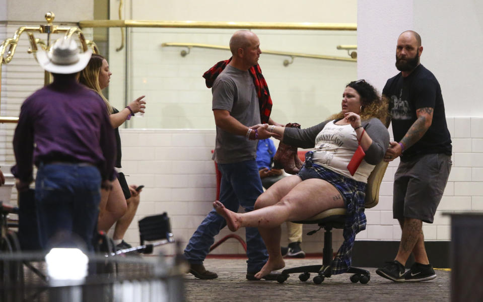 <p>A wounded woman is moved outside the Tropicana during an active shooter situation on the Las Vegas Strip in Las Vegas Sunday, Oct. 1, 2017. (Photo: Chase Stevens/Las Vegas Review-Journal via AP) </p>