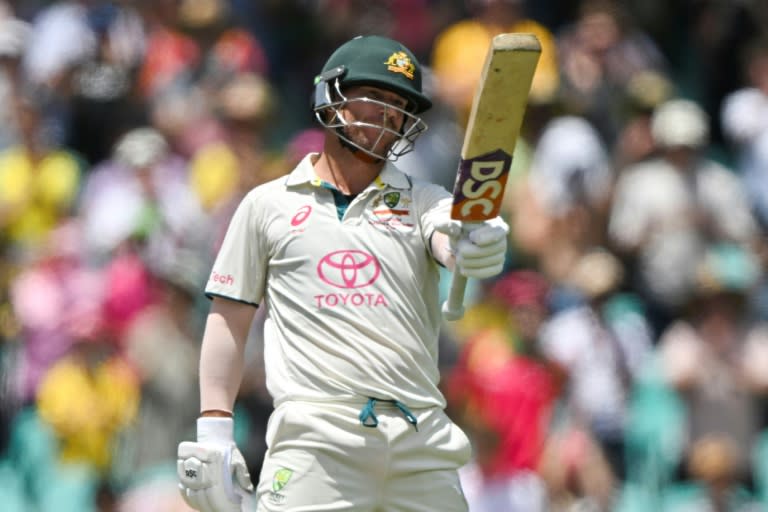 Australia’s David Warner celebrates reaching his half century in his final Test innings (Saeed KHAN)