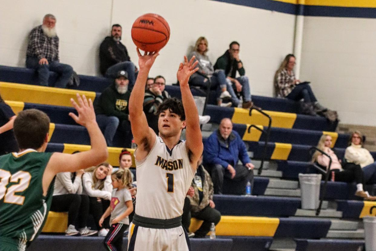 Erie Mason's Alex Langenderfer takes a shot against Sand Creek on Thursday, January 5, 2023.