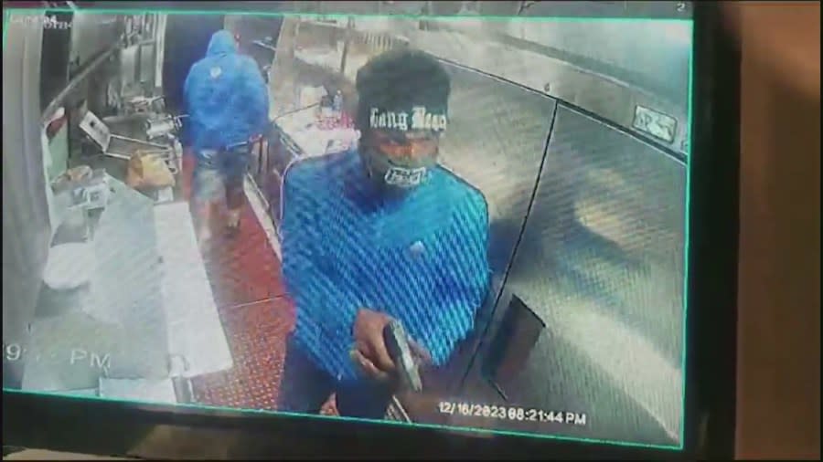 Surveillance video captured masked thieves storming into the Los Bros Tacos truck on Dec. 16, 2023 in Long Beach. (Los Bros Tacos)