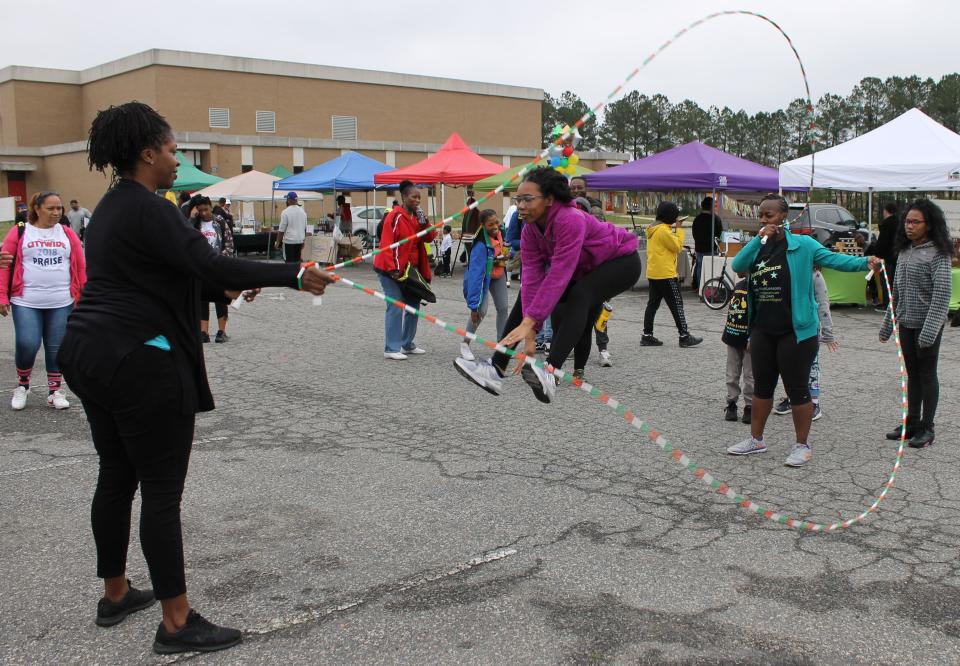 Fourteen-year-old Madison Johnson provides a Double Dutch demonstration during Donamatrix Day at Petersburg High School in 2019.