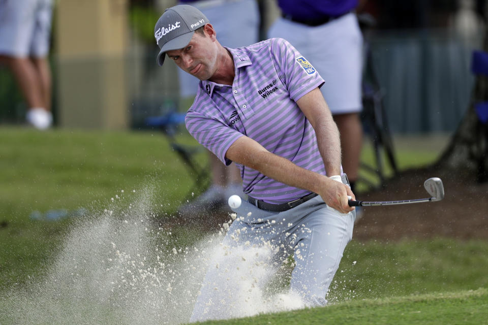 Webb Simpson hits out a bunker on the 16th hole during the final round of the World Golf Championships-FedEx St. Jude Invitational, Sunday, July 28, 2019, in Memphis, Tenn. (AP Photo/Mark Humphrey)