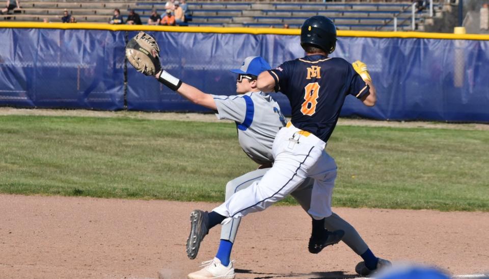 Ida’s Jaxon Millican stretches for the ball at first base to retire Cole Kreger of Erie Mason on Monday, April 15, 2024. Ida swept the doubleheader 7-6 and 10-0 for its first two wins of the season.