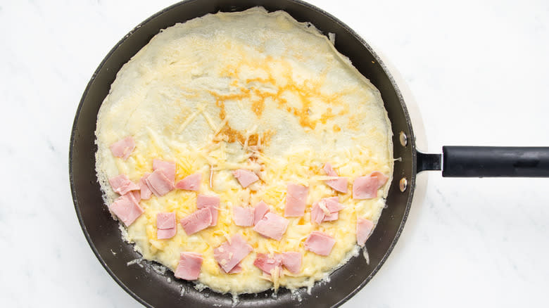Cheese and ham crepe in pan