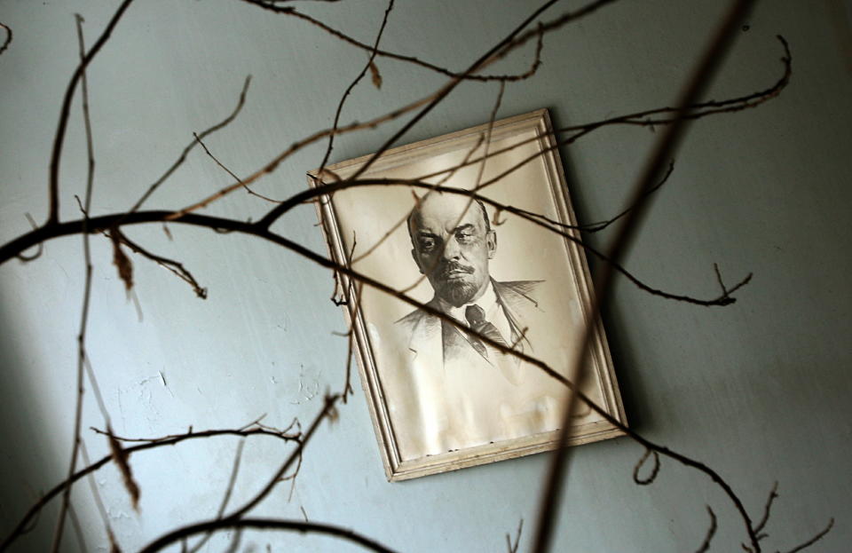 A picture of Soviet state founder Vladimir Lenin is seen through wild flowers inside a hospital in the abandoned town of Pripyat, in the 30 km (19 miles) exclusion zone around the closed Chernobyl nuclear power plant March 31, 2006. [Around 50,000 Pripyat residents were evacuated after the disaster, taking only few belongings. Ukraine is preparing to mark the 20th anniversary of the world's worst nuclear disaster, when a reactor at the Chernobyl plant exploded, spreading radioactivity across Europe and the Soviet Union. ]