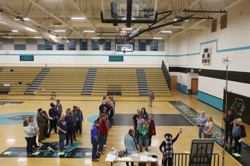 Voters participate in the Nevada Democratic presidential caucuses at North Valleys High School in Reno