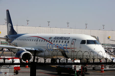 FILE PHOTO: An aeroplane of Aeromexico Connect, regional operator of Mexico's largest airline Aeromexico, is pictured at the airstrip at Benito Juarez international airport in Mexico City, Mexico, November 28, 2017. The plane pictured is the Aeromexico-operated Embraer passenger jet that crashed just after takeoff in Mexico's state of Durango on July 31, 2018. REUTERS/Ginnette Riquelme