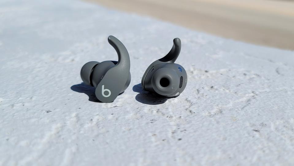 The Beats Fit Pro wireless earbuds shown outside of the charging