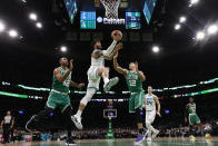 Charlotte Hornets' Miles Bridges goes to the basket past Boston Celtics' Al Horford and Grant Williams (12) during the second half of an NBA basketball game Wednesday, Jan. 19, 2022, in Boston. (AP Photo/Winslow Townson)