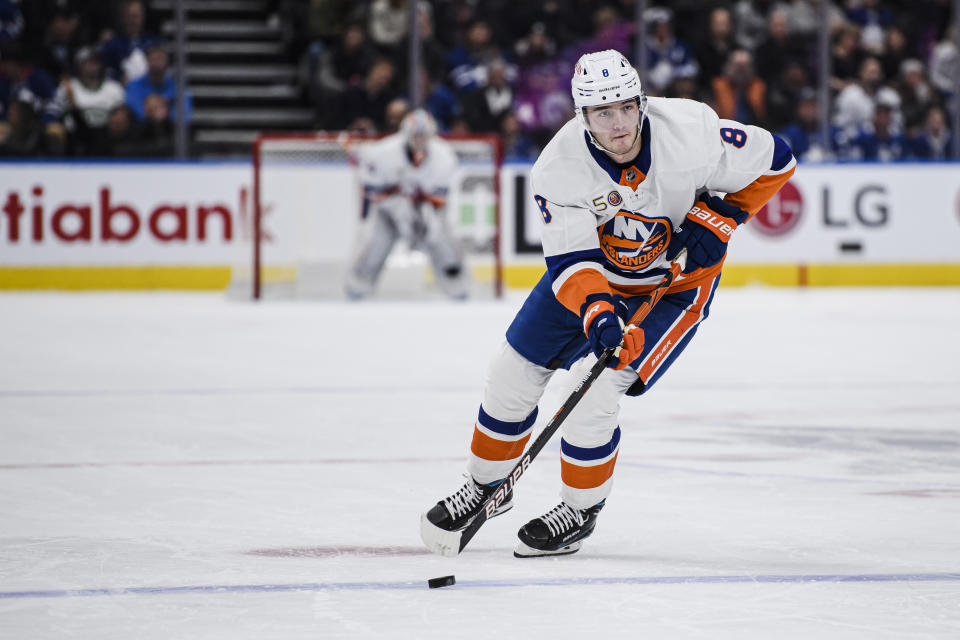 New York Islanders defenseman Noah Dobson (8) advances the puck during first-period NHL hockey game action against the Toronto Maple Leafs in Toronto, Monday, Nov. 21, 2022. (Christopher Katsarov/The Canadian Press via AP)