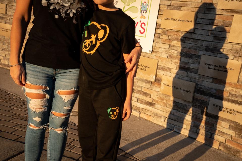 A Middle Tennessee mother and her 10-year-old son pose for a portrait in Hendersonville on Nov. 8. The boy developed severe anxiety, depression and frequent seizures after having COVID-19 in September 2020.