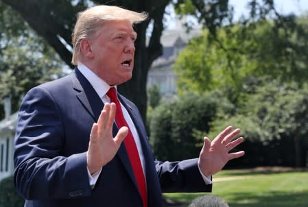 U.S. President Donald Trump speaks to the news media from the South Lawn of the White House in Washington