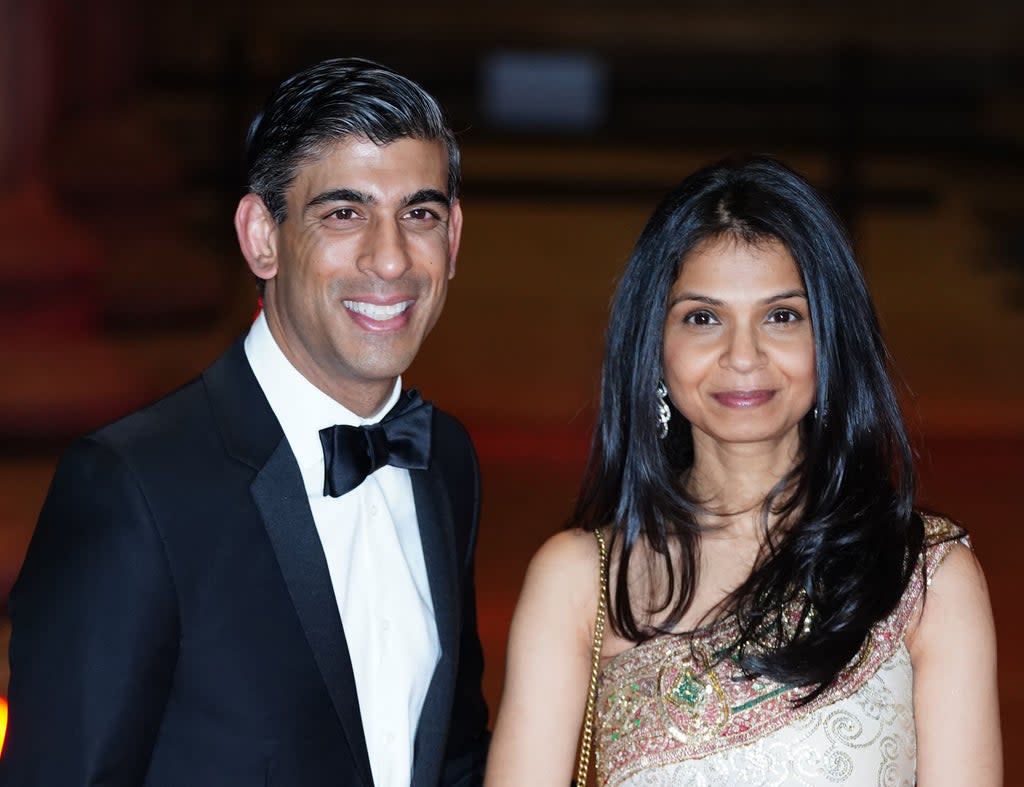 Rishi Sunak alongside his wife Akshata Murthy (PA Wire)