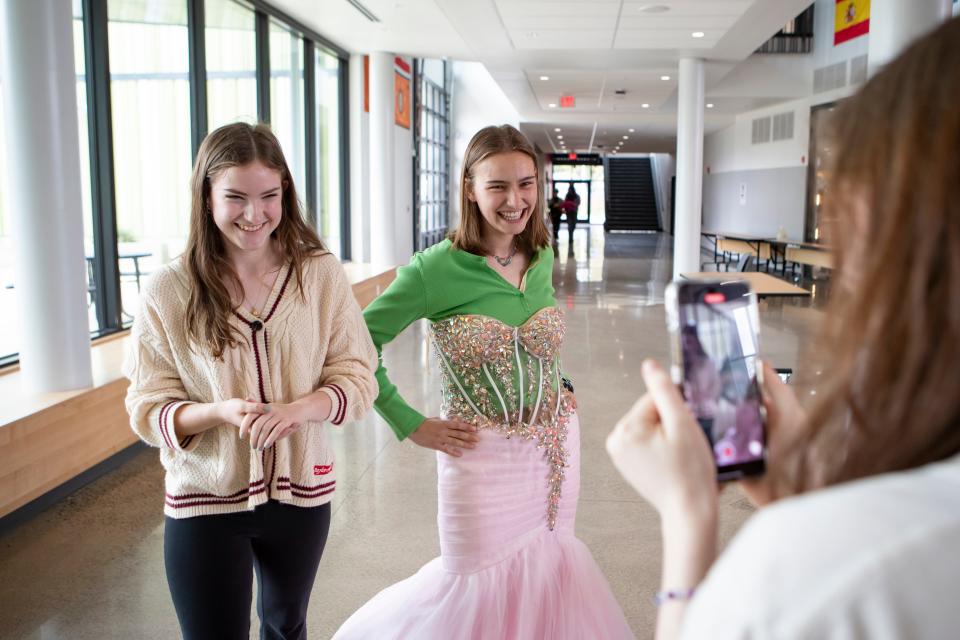 Abbie Blake, left, and Peyton Groshong make a video on Friday to promote the prom dress giveaway at North Eugene High School.