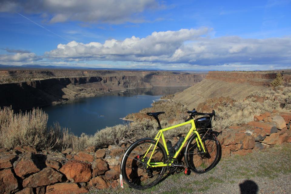 The Madras Mountain Views Scenic Bikeway, a 30 mile route in Central Oregon, takes rides into Cove Palisades State Park and includes views across canyons and Lake Billy Chinook.