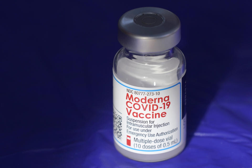 FILE - In this March 4, 2021 file photo, a vial of the Moderna COVID-19 vaccine rests on a table at a drive-up mass vaccination site in Puyallup, Wash., south of Seattle. COVID-19 vaccine sales helped Moderna triple its net income in a better-than-expected first quarter. The vaccine maker said Wednesday, May 4, 2022, that revenue from its coronavirus preventive shots jumped to $5.92 billion from $1.73 billion in last year’s quarter, when the vaccines were debuting in most markets. (AP Photo/Ted S. Warren, File)