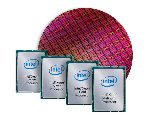 A wafer of Intel Xeon processors in the background with completed and packaged Xeon chips in the foreground.