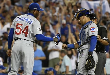 Oct 20, 2016; Los Angeles, CA, USA; Chicago Cubs relief pitcher Aroldis Chapman (54) and catcher Willson Contreras (40) celebrate defeating the Los Angeles Dodgers 8-4 in game five of the 2016 NLCS playoff baseball series at Dodger Stadium. Mandatory Credit: Richard Mackson-USA TODAY Sports