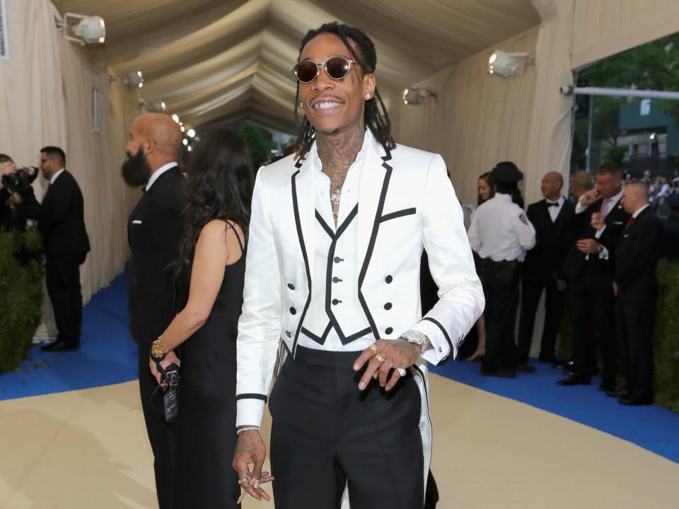 Wiz Khalifa wears a structured white and black tux to the 2017 Met Gala.