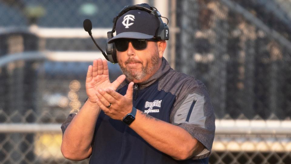 Timber Creek football coach Brian Wright applaudes his players during the game between Timber Creek and Rancocas Valley played at Timber Creek Regional High School in Sicklerville on Friday, September 16, 2022.  Timber Creek defeated Rancocas Valley, 28-15.  