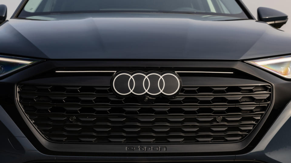 A close-up of the 2024 Audi Q8 e-tron's new four-ringed logo.
