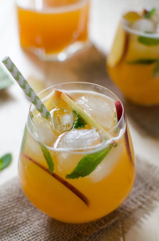 <p>Because a taste of summer is warranted in the thick of winter. </p><p><strong>Get the recipe: <a href="https://www.watchwhatueat.com/perfect-lemonade-recipe/" rel="nofollow noopener" target="_blank" data-ylk="slk:Peach Lemonade Punch;elm:context_link;itc:0;sec:content-canvas" class="link rapid-noclick-resp">Peach Lemonade Punch</a></strong></p>