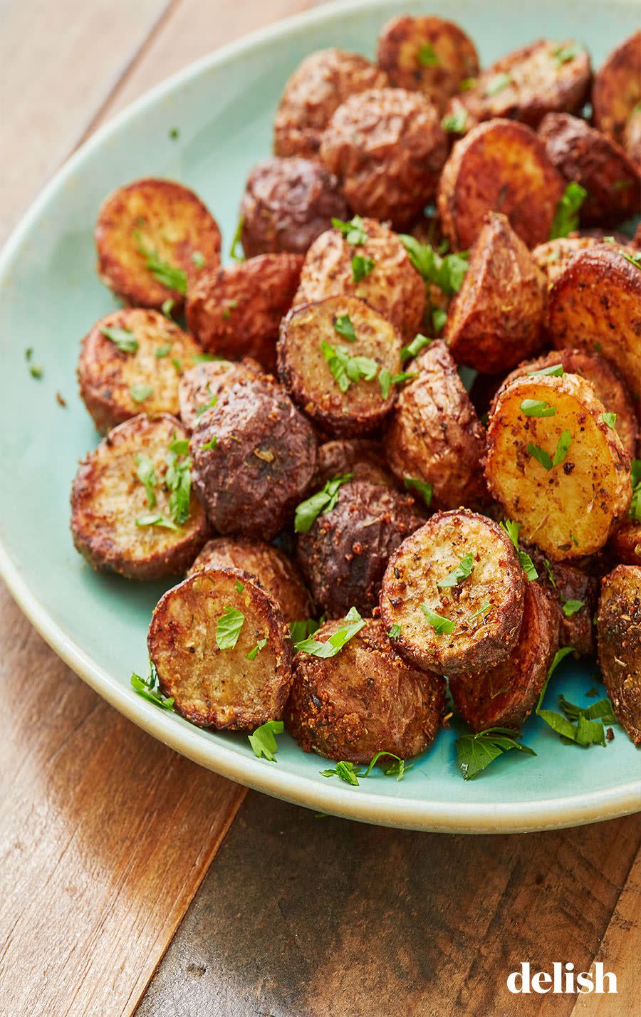 <p>One of our fav air fryer recipes to date. And that's saying <em>a lot</em>. </p><p>Get the recipe from <a href="https://www.delish.com/cooking/recipe-ideas/a28414561/air-fryer-potatoes-recipe/" rel="nofollow noopener" target="_blank" data-ylk="slk:Delish" class="link ">Delish</a>.</p>