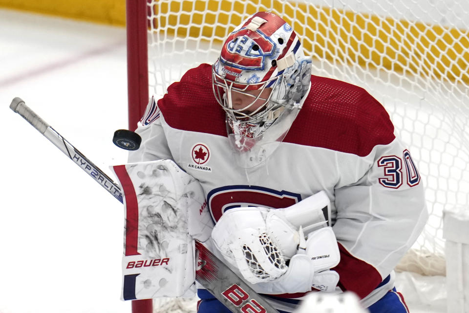 A shot bounces off Montreal Canadiens goaltender Cayden Primeau during the first period of an NHL hockey game against the Pittsburgh Penguins in Pittsburgh, Thursday, Feb. 22, 2024. (AP Photo/Gene J. Puskar)