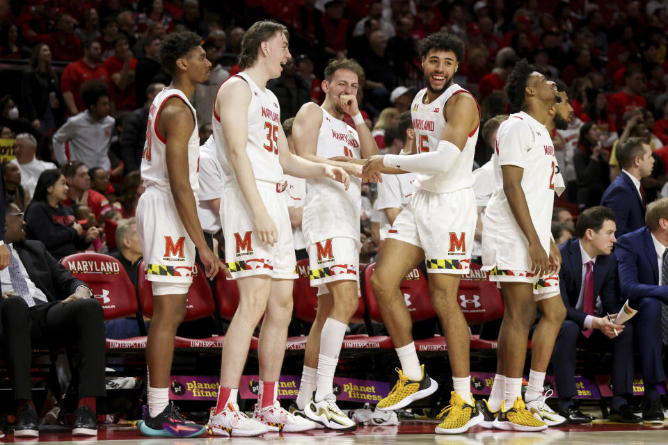 Maryland forward Ike Cornish (20), center Caelum Swanton-Rodger (35), forward Noah Batchelor (11), forward Patrick Emilien (15) and guard Jahari Long (2) react during the second half of an NCAA college basketball game against Northwestern, Sunday, Feb. 26, 2023, in College Park, Md. Maryland won 75-59. (AP Photo/Julia Nikhinson)