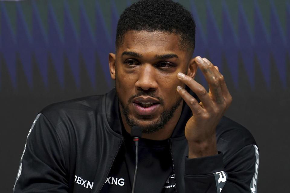 Britain's Anthony Joshua speaks during a press conference after his loss to Oleksandr Usyk of Ukraine in the WBA (Super), WBO and IBF boxing title bout at the Tottenham Hotspur Stadium in London Saturday Sept. 25, 2021. (Nick Potts/PA via AP)